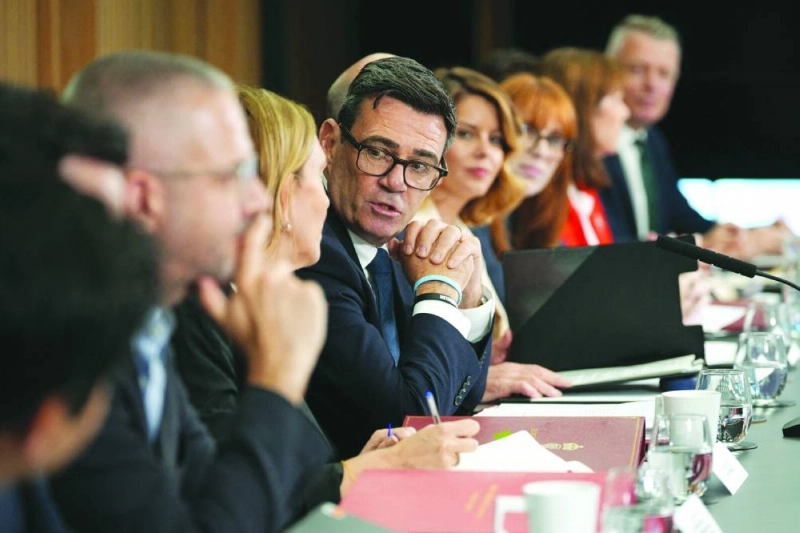 British Prime Minister Andy Burnham holds a National Economic Council meeting at No 10 North at Heron House in Manchester, north-west England on Friday. Burnham opened his newly created northern office as he bids to launch his flagship move to reverse decades of centralising power over England in London. (AFP)
British Prime Minister Andy Burnham holds a National Economic Council meeting at No 10 North at Heron House in Manchester, north-west England on Friday. Burnham opened his newly created northern office as he bids to launch his flagship move to reverse decades of centralising power over England in London. (AFP)