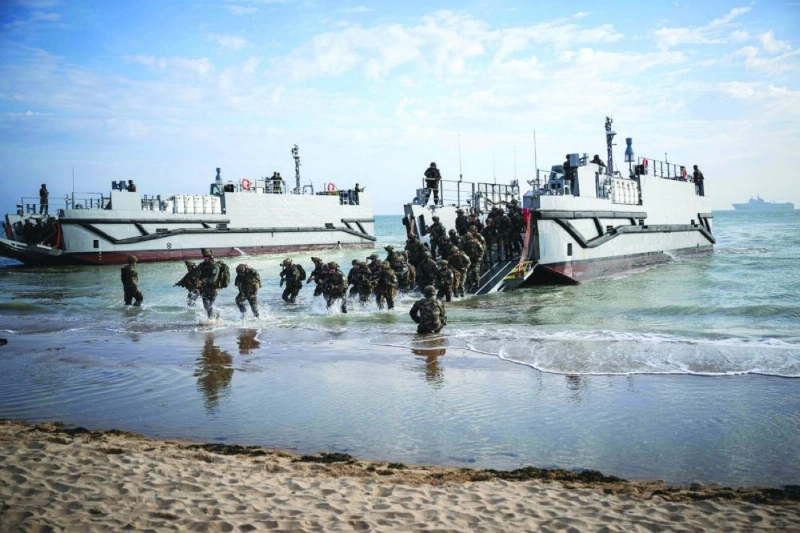 French troops disembark from a US landing craft during a joint US and French amphibious landing operation showcase at Omaha beach in Saint-Laurent-sur-Mer, northwestern France, ahead of the “D-Day” commemorations marking the 80th anniversary of the World War II Allied landings in Normandy. (AFP/File picture) French troops disembark from a US landing craft during a joint US and French amphibious landing operation showcase at Omaha beach in Saint-Laurent-sur-Mer, northwestern France, ahead of the “D-Day” commemorations marking the 80th anniversary of the World War II Allied landings in Normandy. (AFP/File picture)