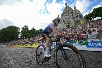 Belgian rider Remco Evenepoel cycles past the Sacre Coeur basilica during the 21st stage of the 113th edition of the Tour de France, 88,7 km starting and finishing in Paris, on July 26, 2026. (AFP) Belgian rider Remco Evenepoel cycles past the Sacre Coeur basilica during the 21st stage of the 113th edition of the Tour de France, 88,7 km starting and finishing in Paris, on July 26, 2026. (AFP)