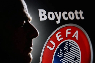 A silhouette depicting FIFA President Gianni Infantino is seen next to a UEFA logo and text reading "Boycott" in this illustration taken July 30, 2026. (Reuters) A silhouette depicting FIFA President Gianni Infantino is seen next to a UEFA logo and text reading "Boycott" in this illustration taken July 30, 2026. (Reuters)