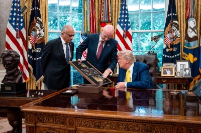 A file photo shows the then former president of the United States Soccer Federation Carlos Cordeiro looks on as FIFA President Gianni Infantino presents US President Donald Trump with a gift in the Oval Office of the White House during a visit by members of Italian soccer club Juventus in Washington, DC, on June 18, 2025. (AFP) A file photo shows the then former president of the United States Soccer Federation Carlos Cordeiro looks on as FIFA President Gianni Infantino presents US President Donald Trump with a gift in the Oval Office of the White House during a visit by members of Italian soccer club Juventus in Washington, DC, on June 18, 2025. (AFP)