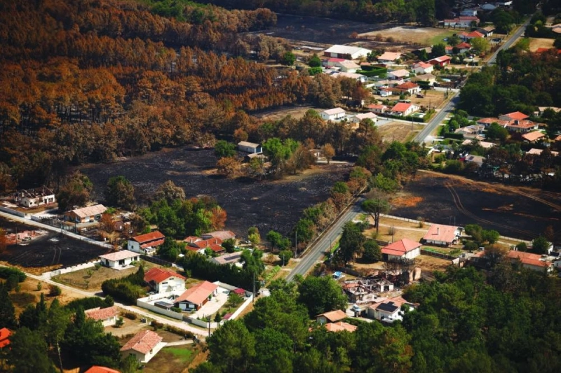 A picture taken from the French Civil Security rescue coordination helicopter shows an area burned by wildfires in Le Porge, Gironde department, amid drought conditions following a heatwave and water shortages across much of France, July 31, 2026. REUTERS/Sarah Meyssonnier/Pool A picture taken from the French Civil Security rescue coordination helicopter shows an area burned by wildfires in Le Porge, Gironde department, amid drought conditions following a heatwave and water shortages across much of France, July 31, 2026. REUTERS/Sarah Meyssonnier/Pool