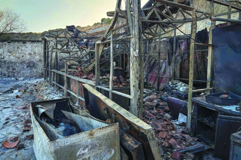 This photograph shows a destroyed beach car following a wildfire at the village of Agios Pavlos in the Greek island of Crete on July 30, 2026. Greece on July 30, 2026 battled to contain a spate of wildfires, including on the tourist island of Crete that forced thousands of locals and holidaymakers to evacuate, and left three firefighters dead. The Crete fire, south of the city of Rethymno, had forced officials to evacuate some 8,000 people overnight as it threatened the village resort of Agia Galini. (Photo by Will VASILOPOULOS / AFP) This photograph shows a destroyed beach car following a wildfire at the village of Agios Pavlos in the Greek island of Crete on July 30, 2026. Greece on July 30, 2026 battled to contain a spate of wildfires, including on the tourist island of Crete that forced thousands of locals and holidaymakers to evacuate, and left three firefighters dead. The Crete fire, south of the city of Rethymno, had forced officials to evacuate some 8,000 people overnight as it threatened the village resort of Agia Galini. (Photo by Will VASILOPOULOS / AFP)