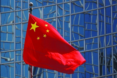 The Chinese national flag is seen in Beijing. China is energetically defending its economic policy mix that favours advanced industries over consumption, adopting a posture analysts see as demonstrating increasing confidence ahead of looming trade talks with Europe and the US. The Chinese national flag is seen in Beijing. China is energetically defending its economic policy mix that favours advanced industries over consumption, adopting a posture analysts see as demonstrating increasing confidence ahead of looming trade talks with Europe and the US.