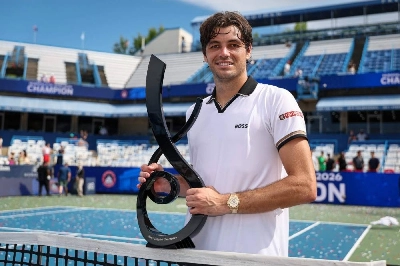 Taylor Fritz of the United States holds the trophy after winning the Washington Open on August 3, 2026. (AFP) Taylor Fritz of the United States holds the trophy after winning the Washington Open on August 3, 2026. (AFP)