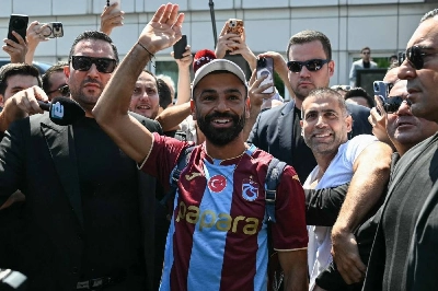 Egyptian forward Mohamed Salah gestures as he arrives at Istanbul Ataturk Airport to complete his transfer to Turkish football club Trabzonspor in Istanbul on August 5, 2026. (AFP) Egyptian forward Mohamed Salah gestures as he arrives at Istanbul Ataturk Airport to complete his transfer to Turkish football club Trabzonspor in Istanbul on August 5, 2026. (AFP)