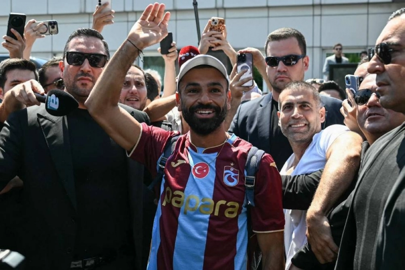 Egyptian forward Mohamed Salah gestures as he arrives at Istanbul Ataturk Airport to complete his transfer to Turkish football club Trabzonspor in Istanbul on August 5, 2026. (AFP) Egyptian forward Mohamed Salah gestures as he arrives at Istanbul Ataturk Airport to complete his transfer to Turkish football club Trabzonspor in Istanbul on August 5, 2026. (AFP)