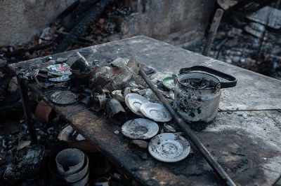 Greek officials and residents of a region west of the capital Athens on August 5, 2026, began to assess the damage suffered by homes, businesses and farmland scorched by a wildfire. (AFP) Greek officials and residents of a region west of the capital Athens on August 5, 2026, began to assess the damage suffered by homes, businesses and farmland scorched by a wildfire. (AFP)