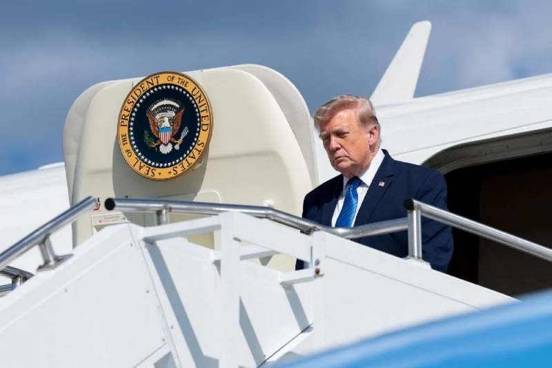 MORRISTOWN, NEW JERSEY - July 31: President Donald Trump walks off Air Force One at the Morristown Municipal Airport on July 31, 2026 in Morristown, New Jersey. Trump is spending the weekend at Trump National Golf Club Bedminster after holding a Cabinet meeting at Camp David. Anna Moneymaker/Getty Images/AFP (Photo by Anna Moneymaker / GETTY IMAGES NORTH AMERICA / Getty Images via AFP) MORRISTOWN, NEW JERSEY - July 31: President Donald Trump walks off Air Force One at the Morristown Municipal Airport on July 31, 2026 in Morristown, New Jersey. Trump is spending the weekend at Trump National Golf Club Bedminster after holding a Cabinet meeting at Camp David. Anna Moneymaker/Getty Images/AFP (Photo by Anna Moneymaker / GETTY IMAGES NORTH AMERICA / Getty Images via AFP)