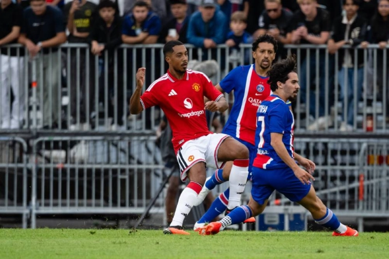 Manchester United's Youri Tielemans (left) vies for the ball with Paris Saint-Germain's Marquinhos and Vitinha during a friendly match in Gothenburg, Sweden.