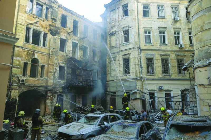 Ukrainian rescuers work in the courtyard of a damaged building at the site of a Russian air attack in Odesa Sunday. (AFP) Ukrainian rescuers work in the courtyard of a damaged building at the site of a Russian air attack in Odesa Sunday. (AFP)