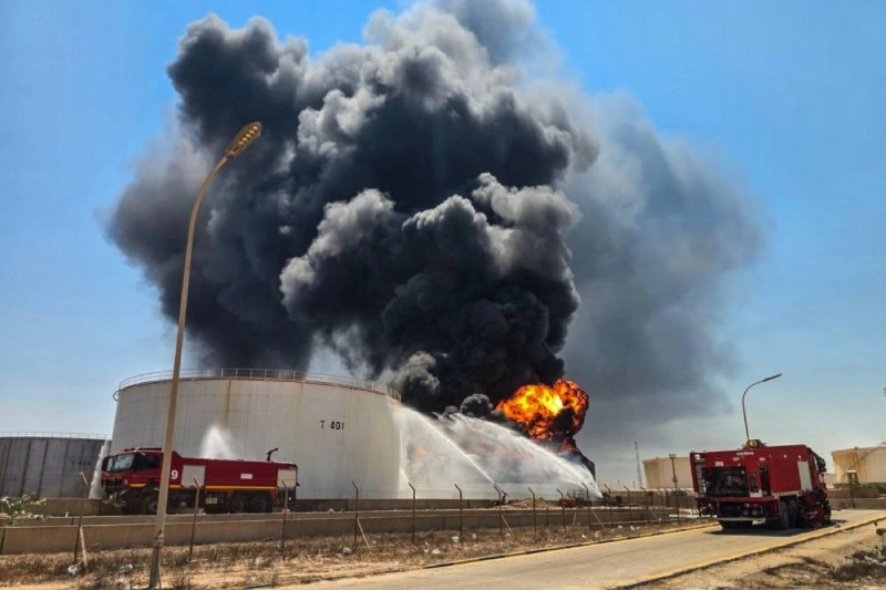 Firefighting teams attempt to extinguish a fire at the Zawiya oil refinery, the second-largest in Libya, with a capacity of 120,000 barrels per day on Tuesday. Located west of Tripoli, Zawiya, which hosts Libya's largest operating refinery, has seen repeated clashes between armed groups. Firefighting teams attempt to extinguish a fire at the Zawiya oil refinery, the second-largest in Libya, with a capacity of 120,000 barrels per day on Tuesday. Located west of Tripoli, Zawiya, which hosts Libya's largest operating refinery, has seen repeated clashes between armed groups.