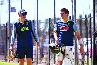 Australian captain Pat Cummins (right) chats with coach Andrew McDonald during training at Marrara Stadium in Darwin on Wednesday. (AFP) Australian captain Pat Cummins (right) chats with coach Andrew McDonald during training at Marrara Stadium in Darwin on Wednesday. (AFP)