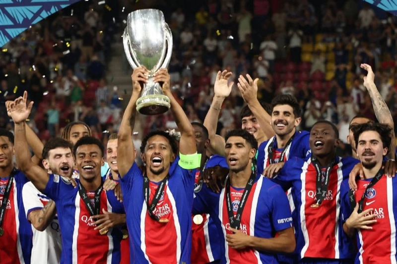 PSG players including Paris Saint-Germain's Brazilian defender #05 Marquinhos (C) celebrate with the trophy after winning the UEFA Supercup football match between Champions League winners Paris Saint Germain (PSG) and Europa League winners Aston Villa in Salzburg, Austria on August 12, 2026. (AFP) PSG players including Paris Saint-Germain's Brazilian defender #05 Marquinhos (C) celebrate with the trophy after winning the UEFA Supercup football match between Champions League winners Paris Saint Germain (PSG) and Europa League winners Aston Villa in Salzburg, Austria on August 12, 2026. (AFP)
