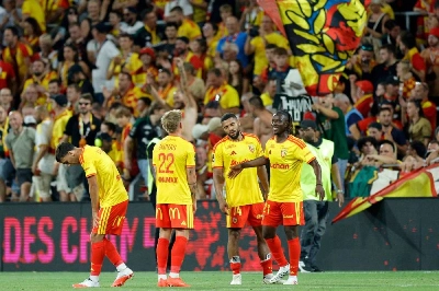 Lens' Michal Skoras, Matthieu Udol and Amadou Haidara celebrate after winning the French Champions' Trophy (Trophee des Champions) at the Stade Bollaert-Delelis in Lens, France. (AFP) Lens' Michal Skoras, Matthieu Udol and Amadou Haidara celebrate after winning the French Champions' Trophy (Trophee des Champions) at the Stade Bollaert-Delelis in Lens, France. (AFP)