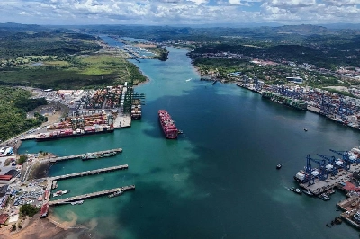 An aerial view of a container ship sailing as it enters the Panama Canal in Panama City. With El Nino strengthening and reservoirs shrinking, the industry is bracing for a repeat of the disruption at one of the world's most important waterways — and some ships are already taking long detours via Africa. An aerial view of a container ship sailing as it enters the Panama Canal in Panama City. With El Nino strengthening and reservoirs shrinking, the industry is bracing for a repeat of the disruption at one of the world's most important waterways — and some ships are already taking long detours via Africa.