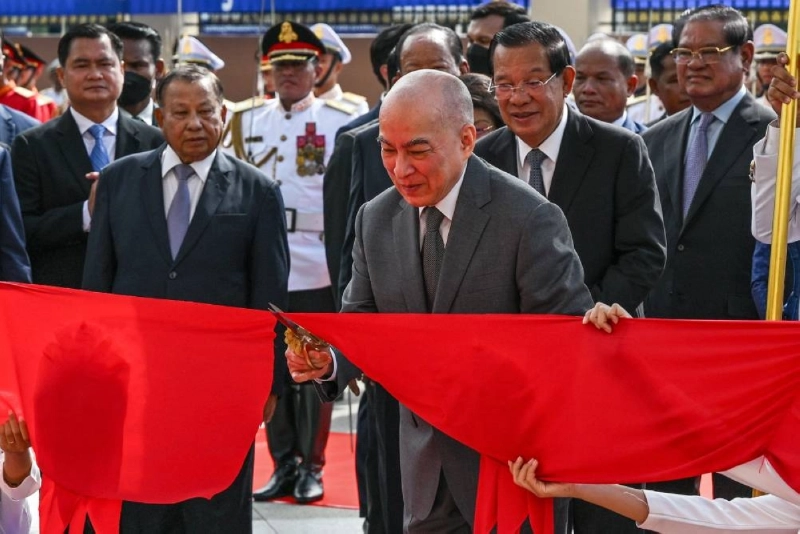 Cambodia's King Norodom Sihamoni cuts the ribbon in front of Cambodian Senate President Hun Sen (centre R) during the inauguration ceremony of the new Senate building in Phnom Penh on Friday. (AFP) Cambodia's King Norodom Sihamoni cuts the ribbon in front of Cambodian Senate President Hun Sen (centre R) during the inauguration ceremony of the new Senate building in Phnom Penh on Friday. (AFP)