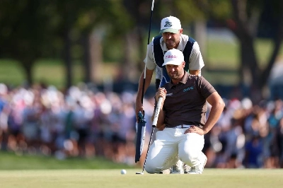 Wyndham Clark of the United States and caddie David Pelekoudas line up a putt on the 18th green during the third round of the BMW Championship at Bellerive Country Club in St Louis, Missouri. (AFP) Wyndham Clark of the United States and caddie David Pelekoudas line up a putt on the 18th green during the third round of the BMW Championship at Bellerive Country Club in St Louis, Missouri. (AFP)