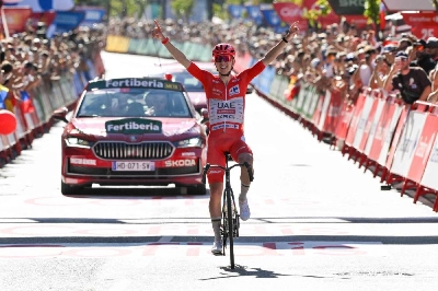 Slovenian rider Tadej Pogacar celebrates as he crosses the finish line to win the fourth stage of the Vuelta a Espana 2026, a 104,8km race in Andorra-la-Vella on August 25, 2026. (AFP) Slovenian rider Tadej Pogacar celebrates as he crosses the finish line to win the fourth stage of the Vuelta a Espana 2026, a 104,8km race in Andorra-la-Vella on August 25, 2026. (AFP)