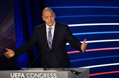 (FILES) President of FIFA Gianni Infantino gestures as he delivers a speech during the 48th UEFA ordinary Congress held at the Maison de la Mutualite in Paris on February 8, 2024. UEFA is preparing a complaint under Swiss law against FIFA president Gianni Infantino for "unfair management”, following his failed plan to open up the World Cup to private investors, it was revealed on August 27, 2026 by a source close to the matter. (Photo by JULIEN DE ROSA / AFP) (FILES) President of FIFA Gianni Infantino gestures as he delivers a speech during the 48th UEFA ordinary Congress held at the Maison de la Mutualite in Paris on February 8, 2024. UEFA is preparing a complaint under Swiss law against FIFA president Gianni Infantino for "unfair management”, following his failed plan to open up the World Cup to private investors, it was revealed on August 27, 2026 by a source close to the matter. (Photo by JULIEN DE ROSA / AFP)