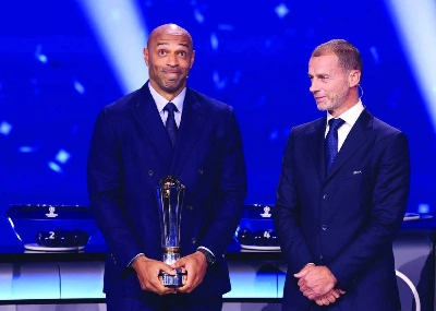 Former French player Thierry Henry (left) receives The UEFA President's Award from UEFA President Aleksander Ceferin during the draw ceremony for the league phase of the 2026-2027 UEFA Champions League at the Grimaldi Forum in the Principality of Monaco on August 27, 2026. (AFP) Former French player Thierry Henry (left) receives The UEFA President's Award from UEFA President Aleksander Ceferin during the draw ceremony for the league phase of the 2026-2027 UEFA Champions League at the Grimaldi Forum in the Principality of Monaco on August 27, 2026. (AFP)