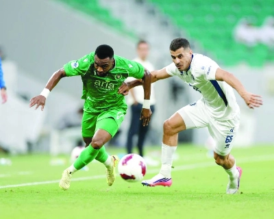 Al Ahli and Lusail SC players battle for the ball at Al Thumama Stadium. Al Ahli and Lusail SC players battle for the ball at Al Thumama Stadium.
