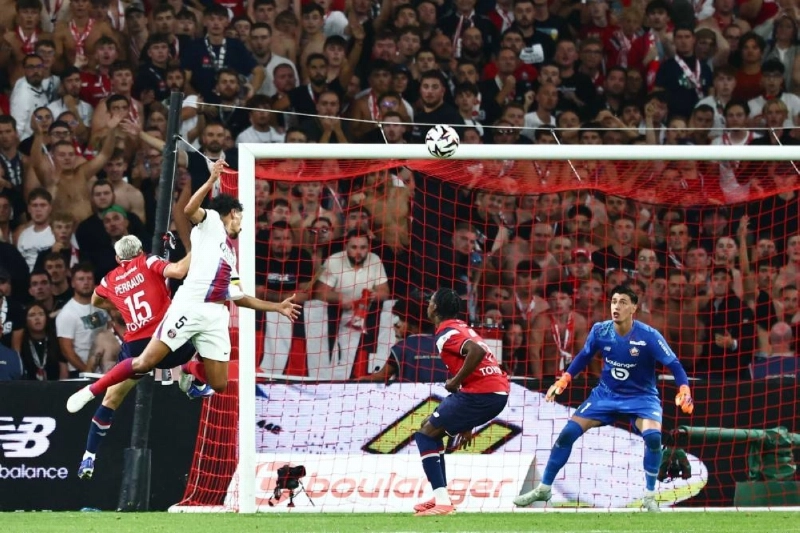 PSG's Brazilian defender Marquinhos heads the ball past Lille's Turkish goalkeeper Berke Ozer to score his team's second goal during the Ligue 1 match at the Stade Pierre-Mauroy in Villeneuve-d'Ascq, northern France, on August 28, 2026. (AFP) PSG's Brazilian defender Marquinhos heads the ball past Lille's Turkish goalkeeper Berke Ozer to score his team's second goal during the Ligue 1 match at the Stade Pierre-Mauroy in Villeneuve-d'Ascq, northern France, on August 28, 2026. (AFP)