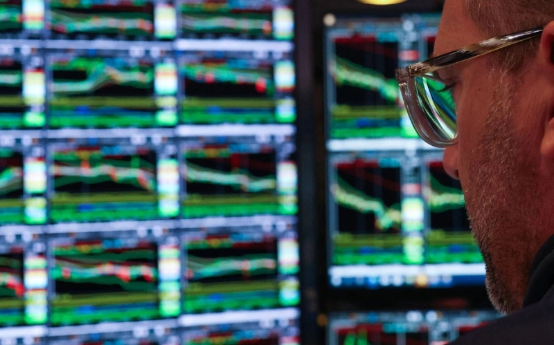 A trader works on the floor of the New York Stock Exchange. Investors are focused on the monthly US employment report, due on September 4, and on whether the jobs data would offer hints about the Federal Reserve's plans for interest rates in coming months. A trader works on the floor of the New York Stock Exchange. Investors are focused on the monthly US employment report, due on September 4, and on whether the jobs data would offer hints about the Federal Reserve's plans for interest rates in coming months.