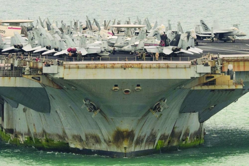 TOPSHOT - Aircrafts are seen on the flight deck of US nuclear-powered aircraft carrier USS Abraham Lincoln (CVN-72) as it heads towards Laem Chabang Port, near the city of Pattaya on September 2, 2026. (Photo by ANTHONY WALLACE / AFP) TOPSHOT - Aircrafts are seen on the flight deck of US nuclear-powered aircraft carrier USS Abraham Lincoln (CVN-72) as it heads towards Laem Chabang Port, near the city of Pattaya on September 2, 2026. (Photo by ANTHONY WALLACE / AFP)