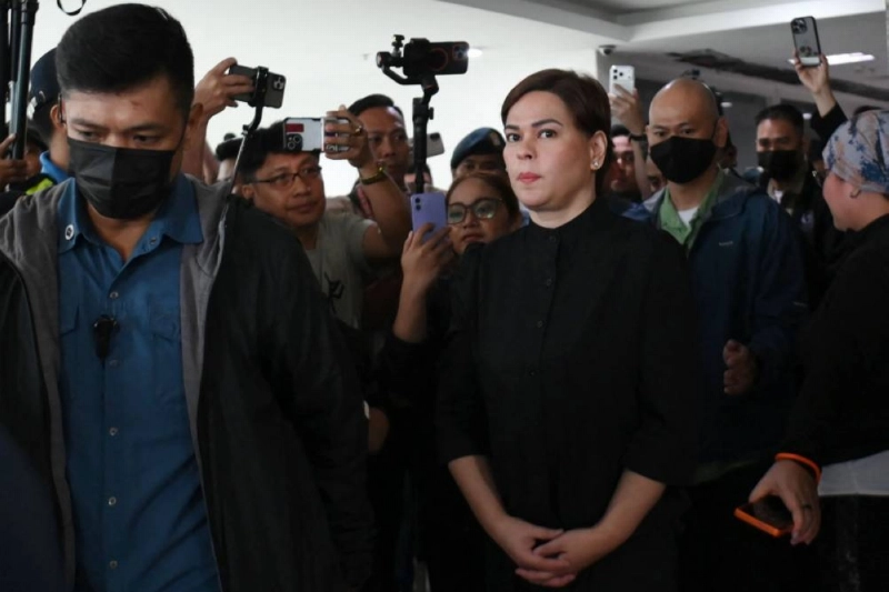 Philippine Vice-President Sara Duterte (front right) leaves court after posting bail in Quezon City, suburban Manila on September 5, 2026. Philippine Vice President Sara Duterte posted bail at a Manila courthouse on May 5, a day after an arrest warrant was issued over her alleged death threat against the country's president. (Photo by Ted ALJIBE / AFP) Philippine Vice-President Sara Duterte (front right) leaves court after posting bail in Quezon City, suburban Manila on September 5, 2026. Philippine Vice President Sara Duterte posted bail at a Manila courthouse on May 5, a day after an arrest warrant was issued over her alleged death threat against the country's president. (Photo by Ted ALJIBE / AFP)