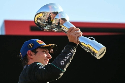 Mercedes' Italian driver Kimi Antonelli celebrates with his trophy on the podium after winning the Italian Grand Prix at the Autodromo Nazionale Monza circuit in Monza, Italy, on September 6, 2026. (AFP) Mercedes' Italian driver Kimi Antonelli celebrates with his trophy on the podium after winning the Italian Grand Prix at the Autodromo Nazionale Monza circuit in Monza, Italy, on September 6, 2026. (AFP)