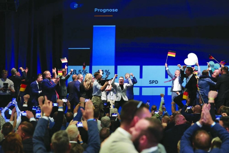Members and supporters of the far-right Alternative for Germany (AfD) party react after the announcement of the first exit poll results on public television at the AfD's election party following Saxony-Anhalt's state elections in Magdeburg, eastern Germany on September 6, 2026. Germany's far-right AfD won key regional elections on September 6 by a landslide with at least 44 percent of the vote in the eastern state of Saxony-Anhalt, said exit polls by two public broadcasters. (Photo by Ronny HARTMANN / AFP) Members and supporters of the far-right Alternative for Germany (AfD) party react after the announcement of the first exit poll results on public television at the AfD's election party following Saxony-Anhalt's state elections in Magdeburg, eastern Germany on September 6, 2026. Germany's far-right AfD won key regional elections on September 6 by a landslide with at least 44 percent of the vote in the eastern state of Saxony-Anhalt, said exit polls by two public broadcasters. (Photo by Ronny HARTMANN / AFP)