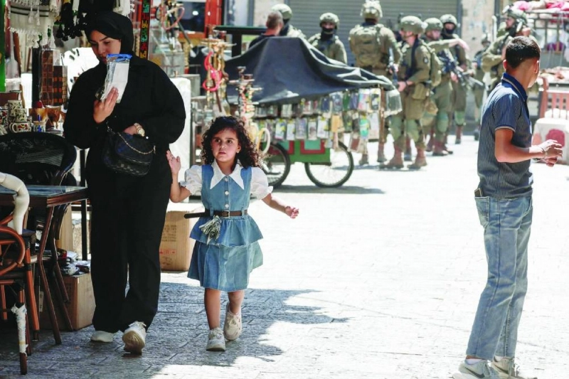 Armed Israeli soldiers carry out a foot patrol through the market, in the Old City of Nablus, in the northern Israeli-occupied West Bank. (AFP)
Armed Israeli soldiers carry out a foot patrol through the market, in the Old City of Nablus, in the northern Israeli-occupied West Bank. (AFP)