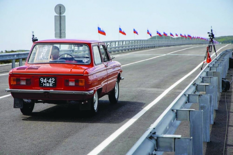 A car crosses the new Russia-North Korea road bridge over the Tumen River, during the opening ceremony, yesterday. (AFP) A car crosses the new Russia-North Korea road bridge over the Tumen River, during the opening ceremony, yesterday. (AFP)