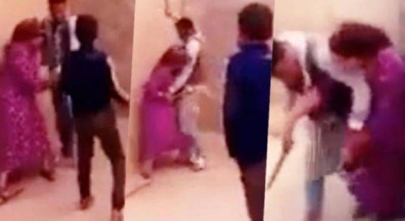 Vues de l'acte d'agression physique perpétré par le mari contre sa femme devant ses enfants désespérés
