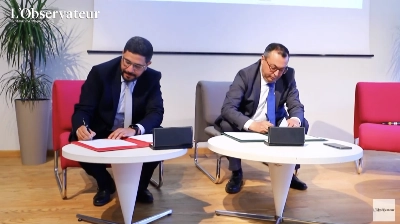 Noureddine Benkhalil, directeur général par intérim de l'ANAPEC, et Rédouane El Haloui, président de l'APEBI signant l'acte de naissance de «JIHATECH-جهتك»