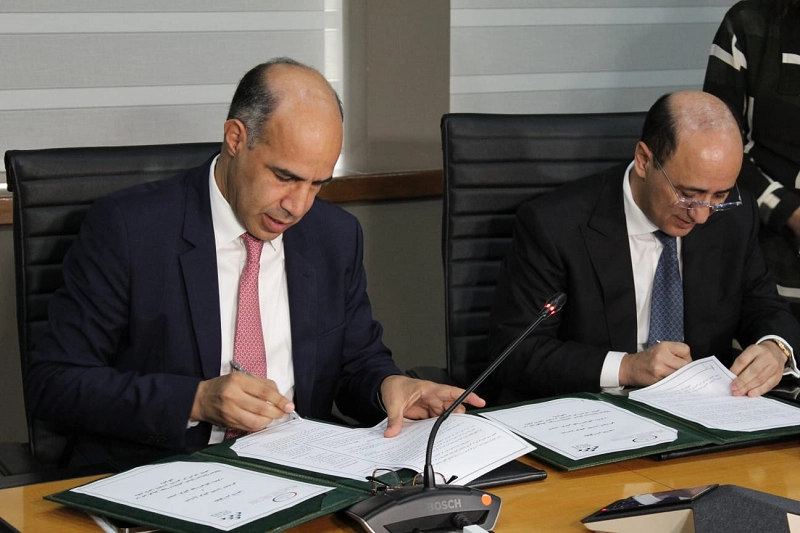 Hassan Boubrik, directeur général de la CNSS, et Hicham Sabiri président de l'Ordre national des notaires du Maroc.