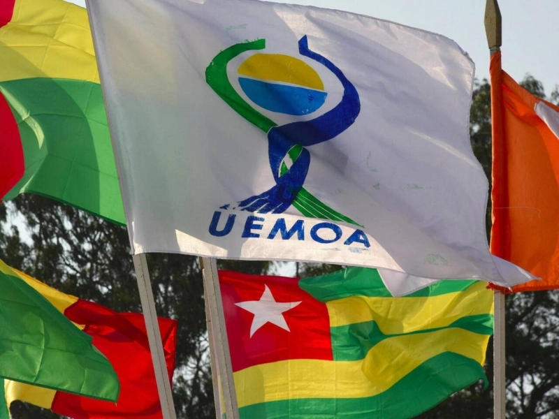 This picture taken on July 12, 2019 shows flags the West African Economic and Monetary Union (UEMOA) countries during the 21st ordinary session of heads of states of The West African Economic and Monetary Union (UEMOA) in Abidjan. (Photo by ISSOUF SANOGO / AFP)