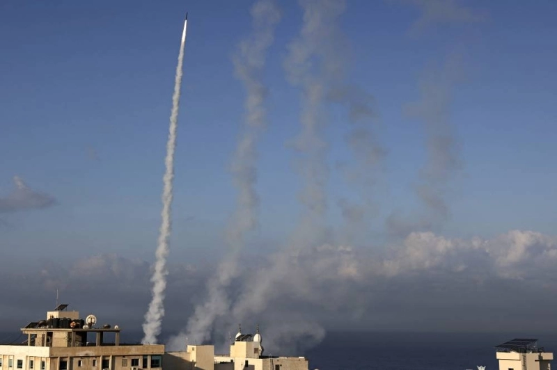Rockets are fired from Gaza City towards Israel on October 7, 2023. Dozens of rockets were fired from the blockaded Gaza Strip towards Israel on October 7, 2023, an AFP journalist in the Palestinian territory said, as sirens warning of incoming fire blared in Israel. (Photo by MOHAMMED ABED / AFP)
