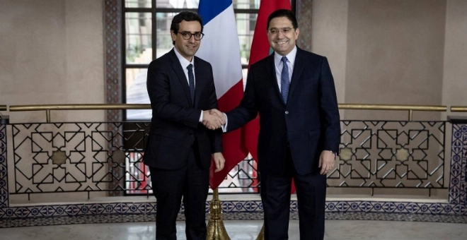 Morocco's Foreign Minister Nasser Bourita (R) greets his French counterpart Stephane Sejourne during a meeting in Rabat on February 26, 2024. (Photo by Fadel SENNA / AFP)