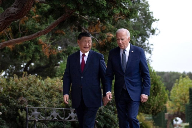 US President Joe Biden (R) and Chinese President Xi Jinping walk together after a meeting during the Asia-Pacific Economic Cooperation (APEC) Leaders' week in Woodside, California on November 15, 2023. - Biden and Xi will try to prevent the superpowers' rivalry spilling into conflict when they meet for the first time in a year at a high-stakes summit in San Francisco on Wednesday. With tensions soaring over issues including Taiwan, sanctions and trade, the leaders of the world's largest economies are expected to hold at least three hours of talks at the Filoli country estate on the city's outskirts. (Photo by Brendan Smialowski / AFP)