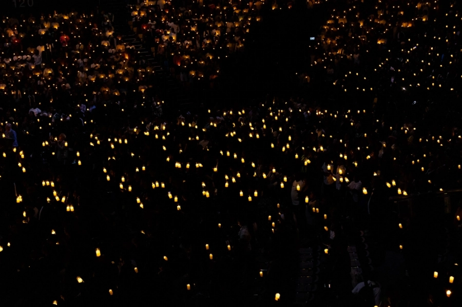Thousands of mourners observe a moment of silence during a Night Vigil was held in remembrance of the genocide, which claimed more than one million lives in between April and July 1994. Thousands of mourners observe a moment of silence during a Night Vigil was held in remembrance of the genocide, which claimed more than one million lives in between April and July 1994.