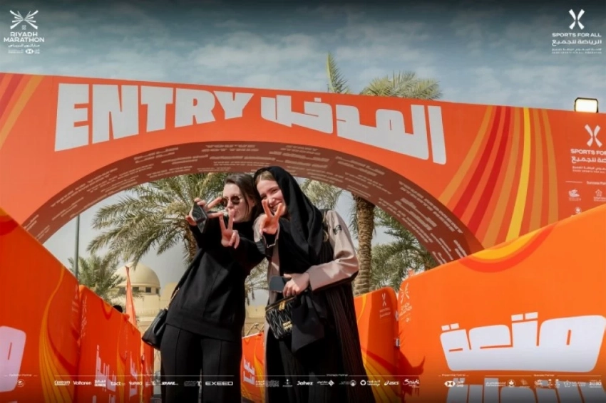 Visitors take a selfie at the entrance of the marathon festival. (X @@SportsforAll_sa)