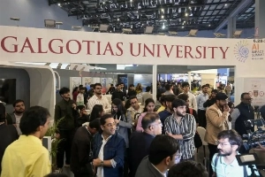 People visit Galgotias University's booth at the India AI Impact Summit in New Delhi, February 18, 2026.