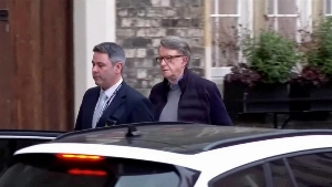 Peter Mandelson was picked up by police and removed from his home in London on Monday.