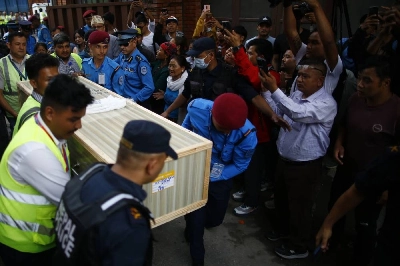 Security personnel carry the coffin containing the body of renowned Nepali mountaineer Pur Bahadur Gurung (Yukta) at Tribhuvan International Airport in Kathmandu, Nepal, on Thursday, August 6, 2026. Photo: Skanda Gautam/THT