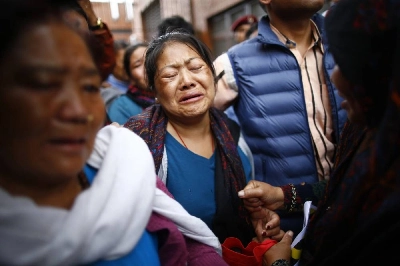 Relatives mourn after the body of renowned Nepali mountaineer Pur Bahadur Gurung (Yukta) arrives at Tribhuvan International Airport in Kathmandu, Nepal, on Thursday, August 6, 2026. Photo: Skanda Gautam/THT