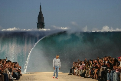 Louis Vuitton designer Pharrell Williams uses giant tidal wave set as backdrop for Paris fashion show