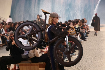 Louis Vuitton designer Pharrell Williams uses giant tidal wave set as backdrop for Paris fashion show