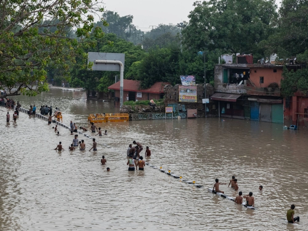 Residents in flood waters in New Delhi on July 14 Residents in flood waters in New Delhi on July 14